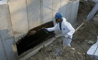 Professional waterproofing the exterior walls of the basement in Las Vegas, NV